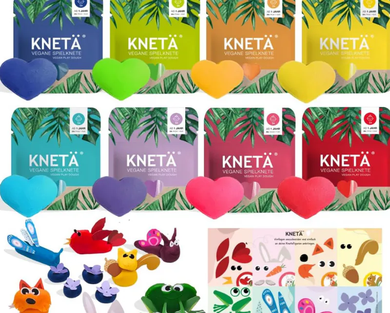 Acht bunte Packungen KNETÄ vegane Knete in Herzform, darüber niedliche Tierfiguren und Bastelideen - eine tolle Geschenkidee für den 2. Geburtstag: niedlich und praktisch für kleine Kreative.